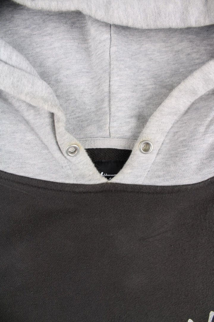 Stussy Two Tone Sweatshirt in a grey colourway with pocket and small logo on the front. Large Stussy logo on the back.