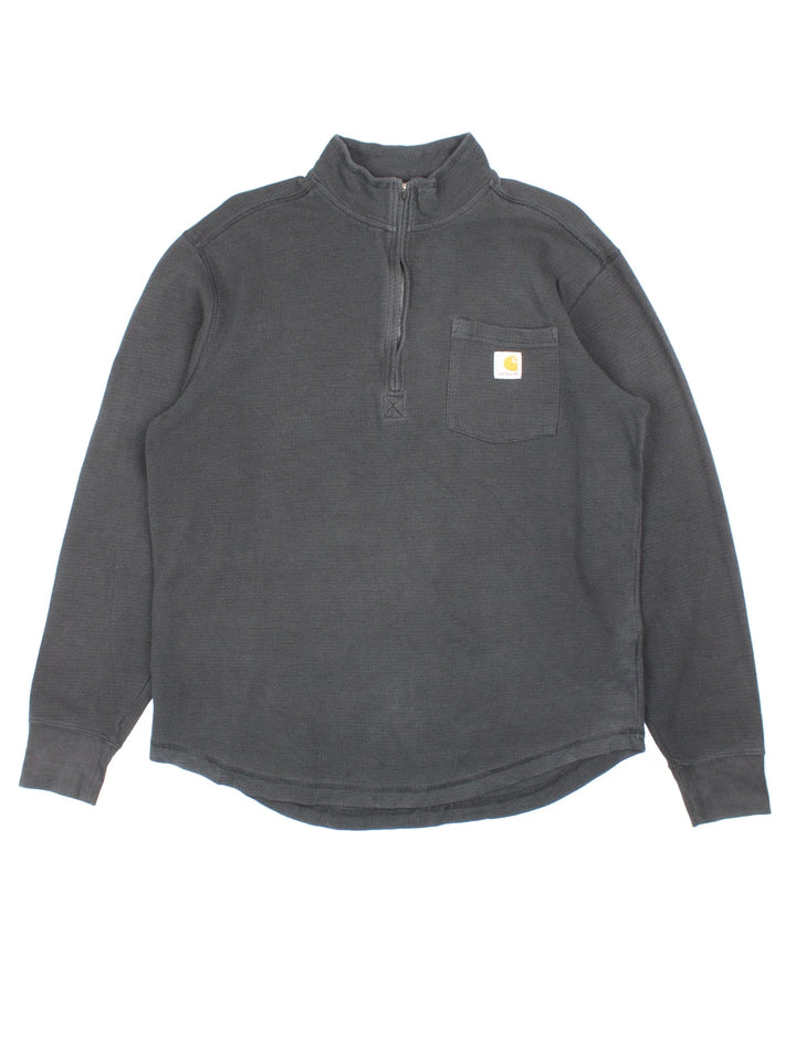 Carhartt 1/4 Zip Sweatshirt in a black colourway with the small classic logo on the front pocket.