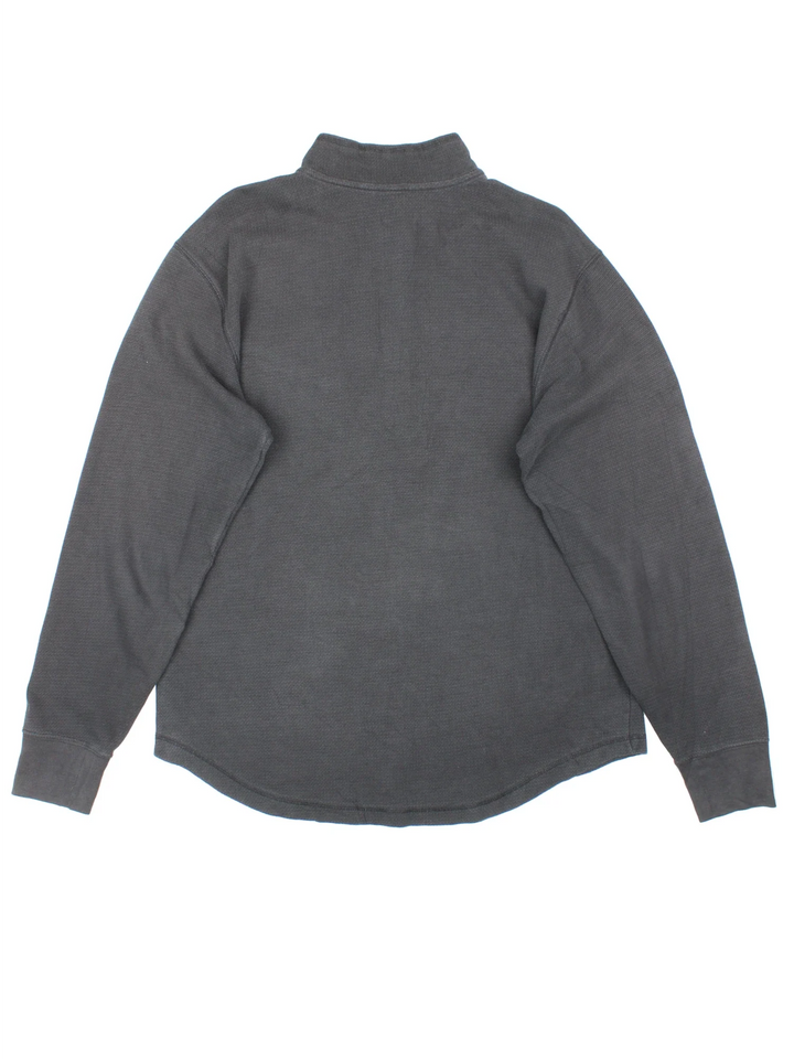 Carhartt 1/4 Zip Sweatshirt in a black colourway with the small classic logo on the front pocket.