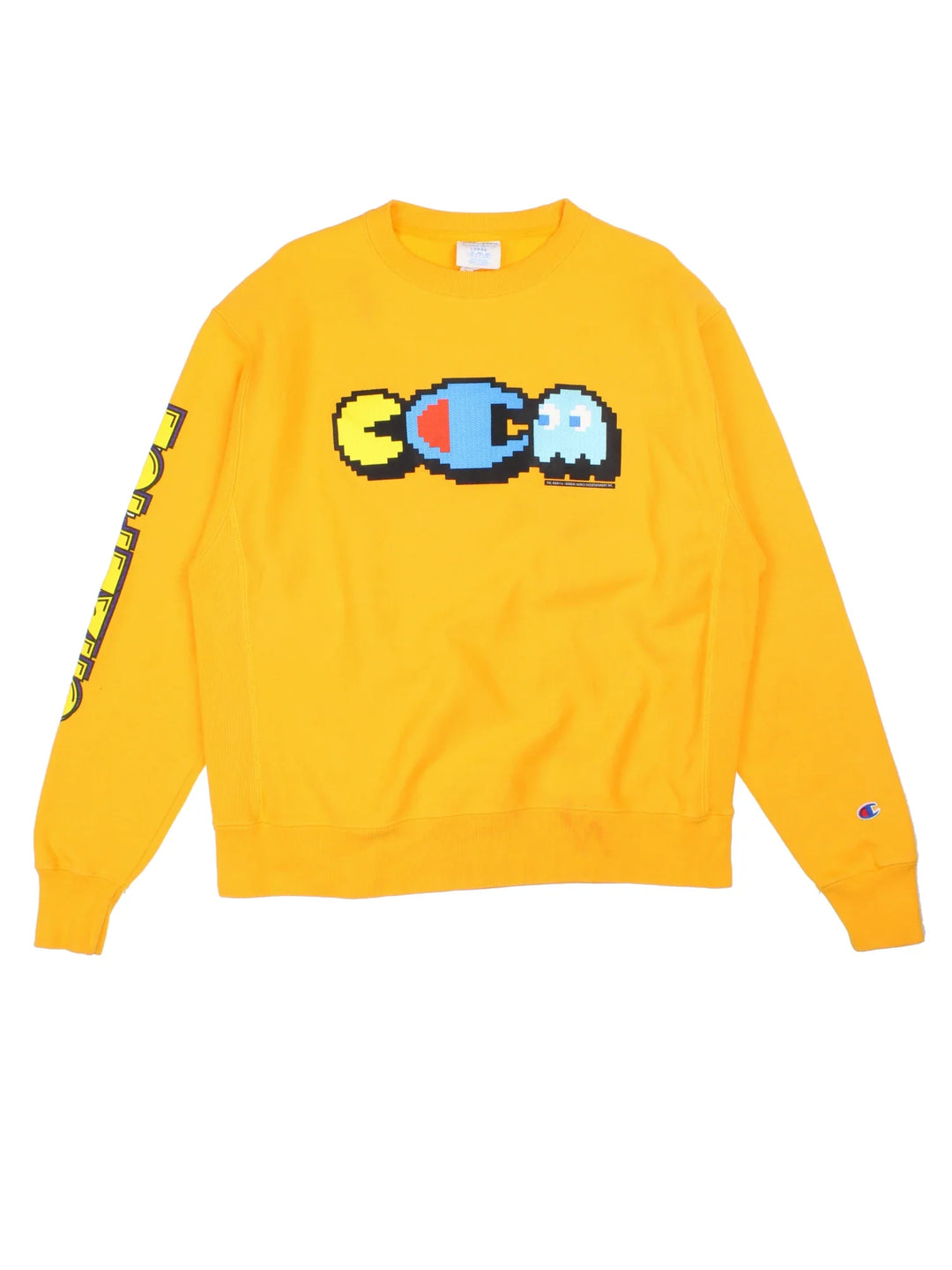 Champion x Pac-Man Sweatshirt in a yellow colourway with the logo and graphic printed on the front and down the right sleeve.