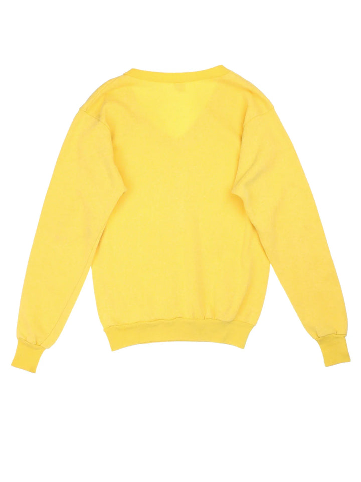 Vintage 60's Wichita State University Sweatshirt in a yellow colourway, v neck collar with the logo and graphic printed on the front.