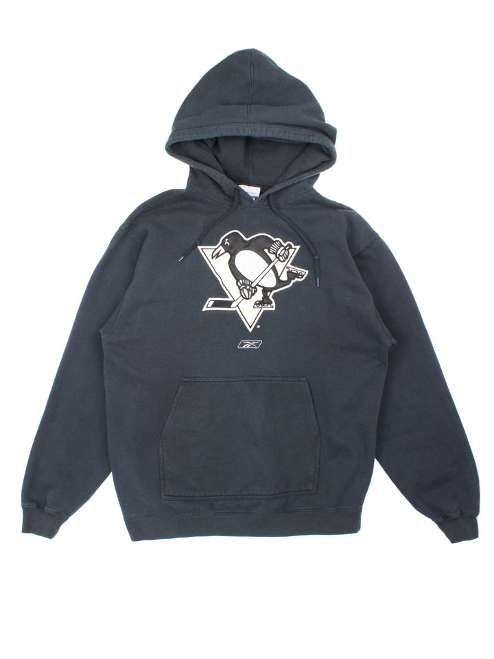Pittsburgh Penguins NHL Reebok Hoodie in a black colourway with the logos embroidered on the front.