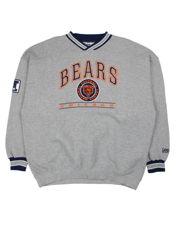 Chicago Bears NFL Sweatshirt in a grey colourway with logo and text graphic across the front and blue detailing around the collar and hem.