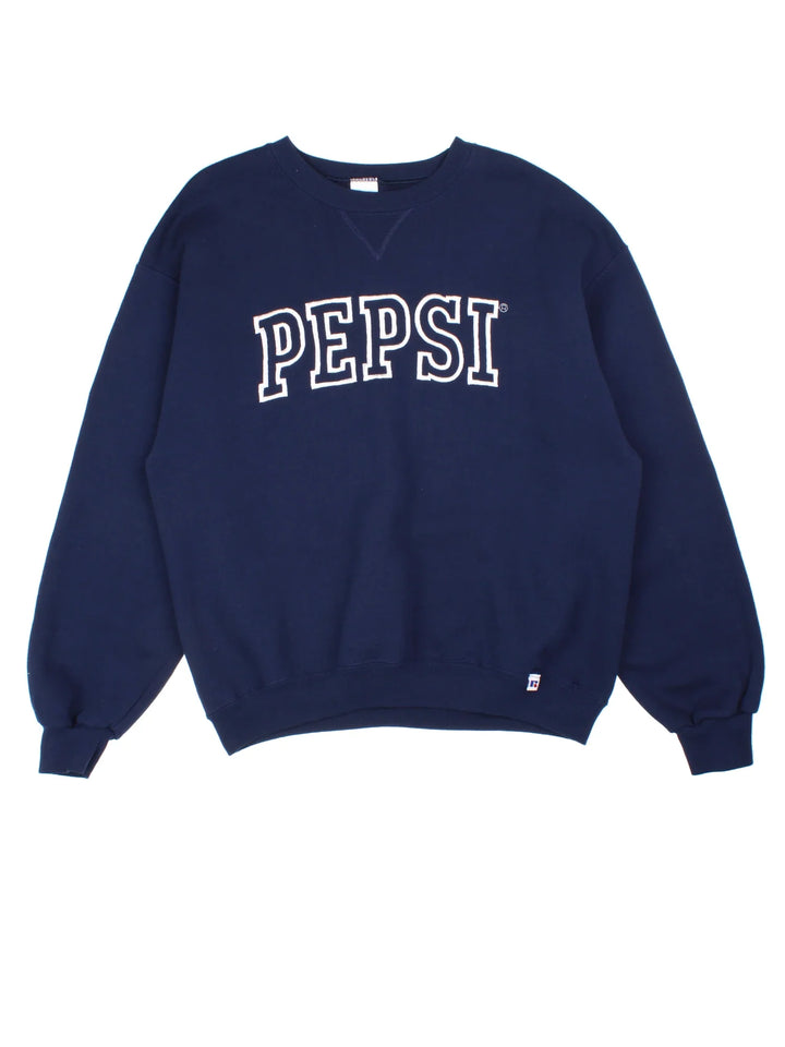 Russell Athletic Pepsi Sweatshirt in a blue colourway. Crew neck and branding embroidered on the front.