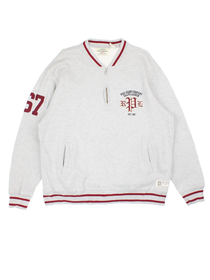 Ralph Lauren Varsity Sweatshirt in a grey colourway with red trim on the collar, hem and sleeves. Logo and number graphic on the front and sleeve.