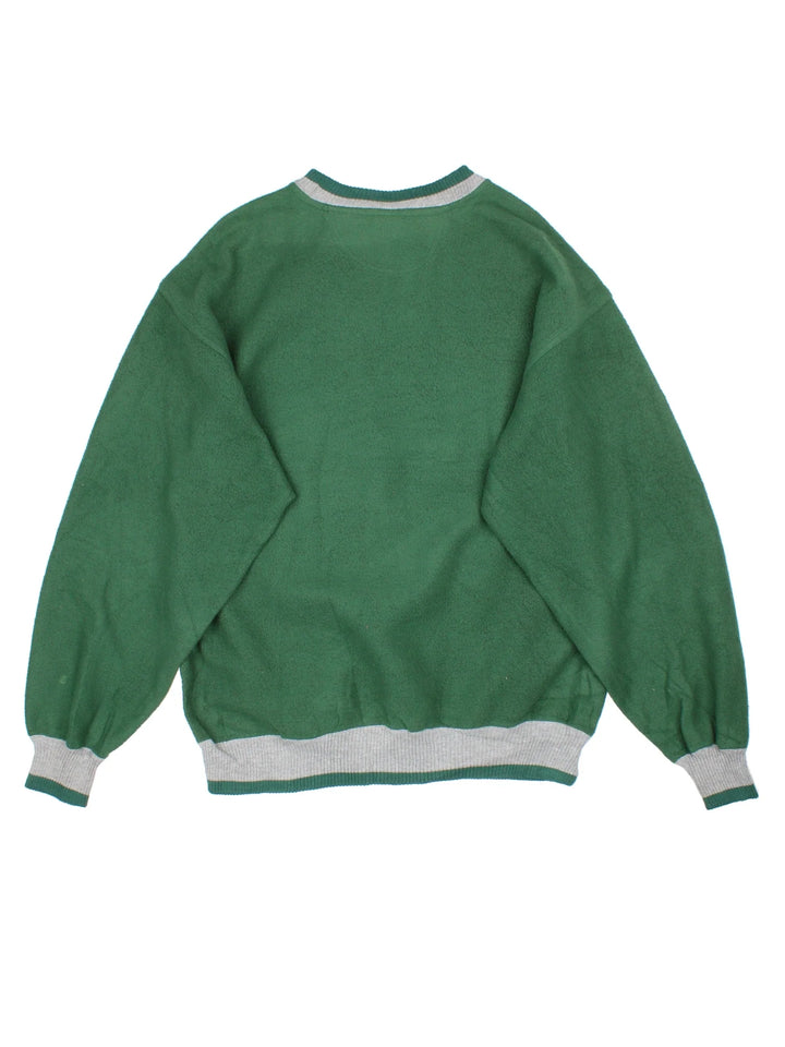 Vintage University Of Miami Hurricanes Sweatshirt in a green colourway, contract cuffs and hems with logo printed on the front.