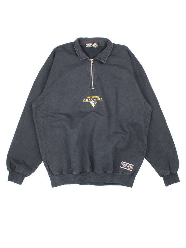 Vintage Pittsburgh Penguins NHL 1/4 Zip Sweatshirt in a black colourway, with graphic embroidered on the front.