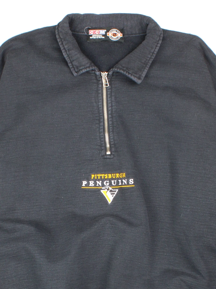Vintage Pittsburgh Penguins NHL 1/4 Zip Sweatshirt in a black colourway, with graphic embroidered on the front.