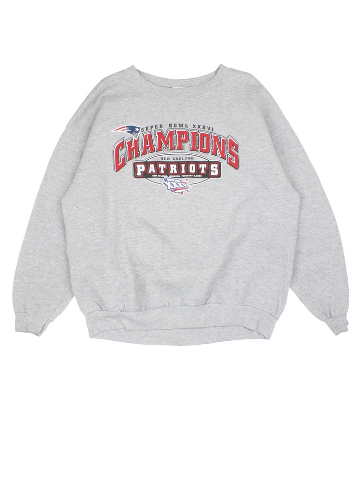 2002 New England Patriots NFL Champions Sweatshirt in a grey colourway, with graphic and spell out printed on the front.