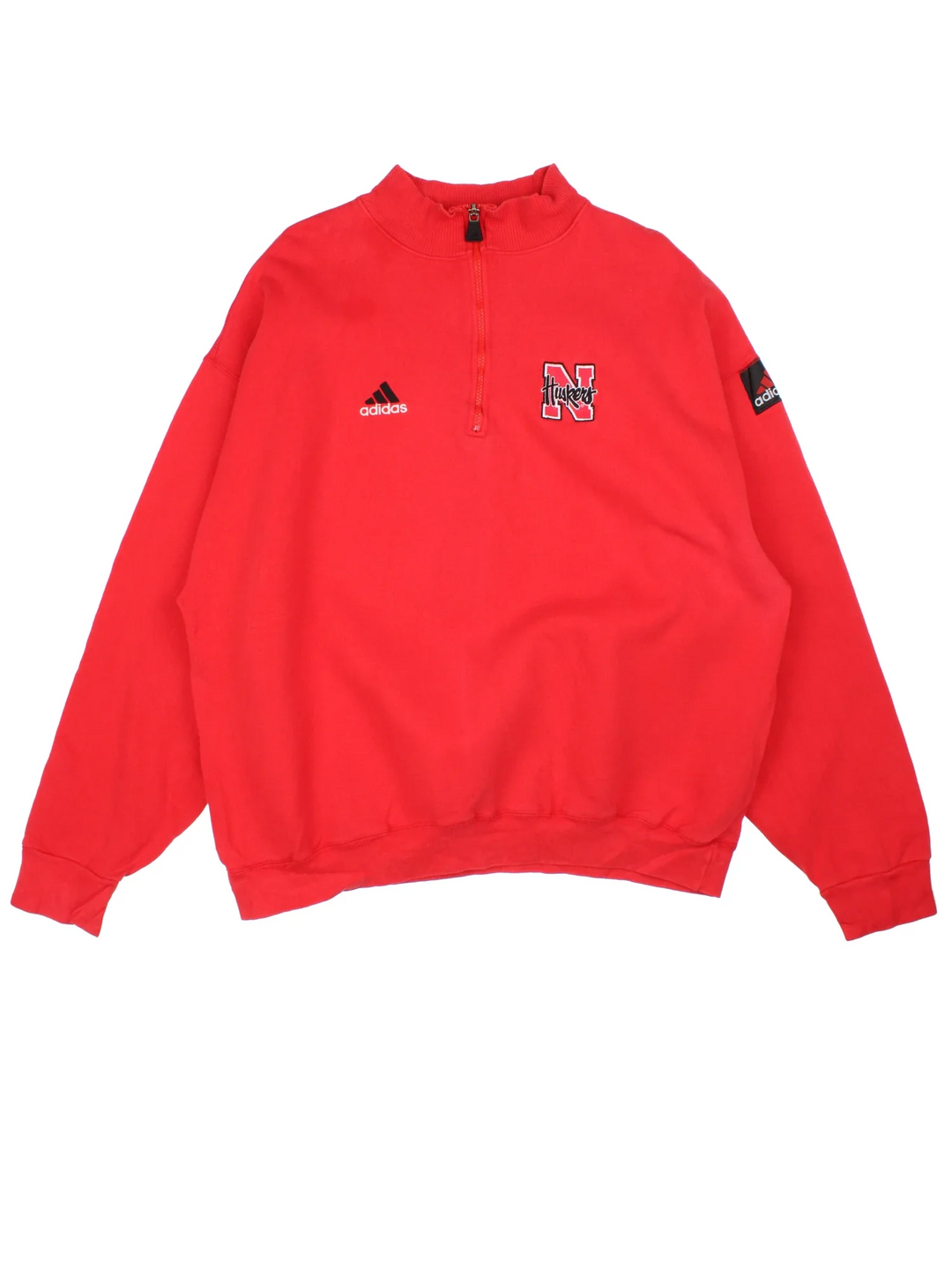Adidas Nebraska Huskers 1/4 Zip Sweatshirt in a red colourway with the Adidas logo and college logo on the chest.