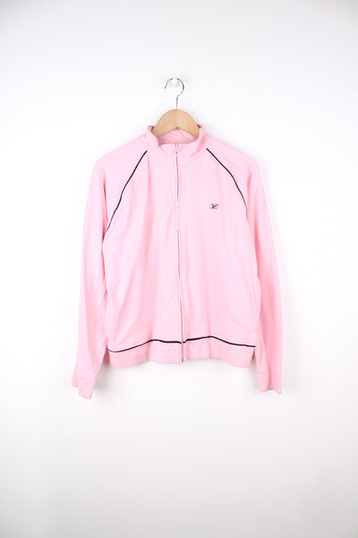 Vintage baby pink Reebok zip through cotton track top, features embroidered logo on the chest and black piping