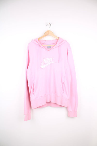 Pink Nike hoodie with embroidered satin logo across the chest.