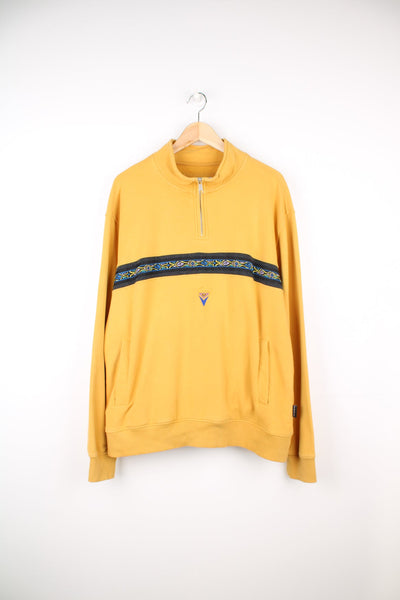 Quiksilver Apres Surf pullover sweatshirt with quarter zip. Features patterned stripe across the chest and embroidered logo.