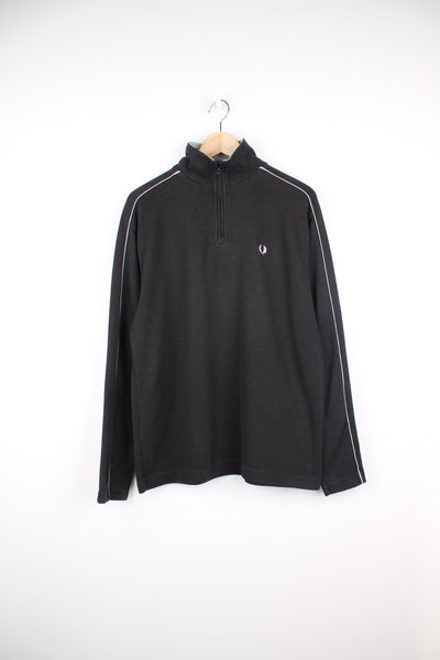 Black Fred Perry pullover sweatshirt with quarter zip and embroidered logo on the chest.