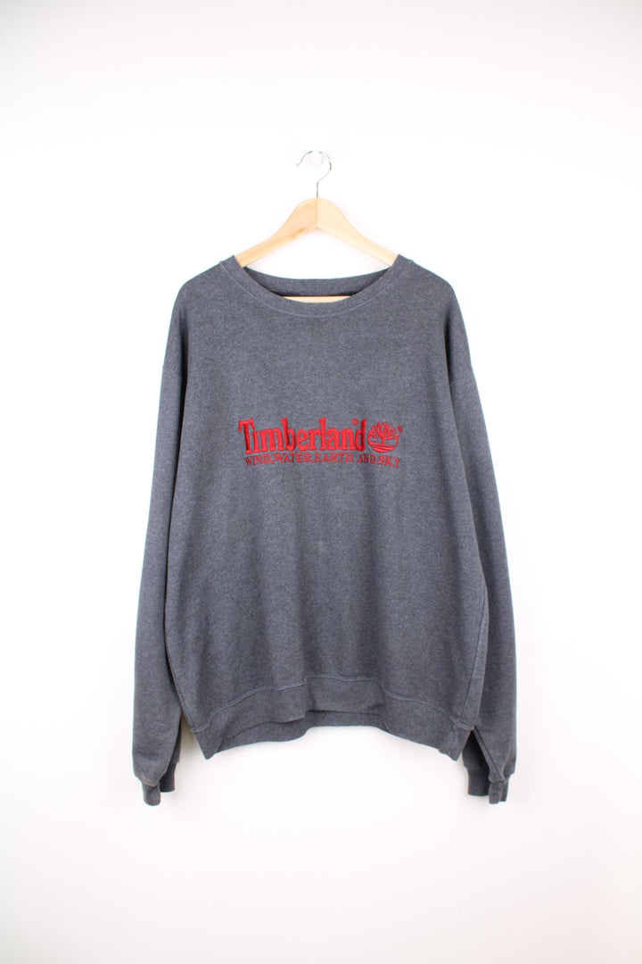 Grey Timberland sweatshirt with red embroidered logo across the chest.