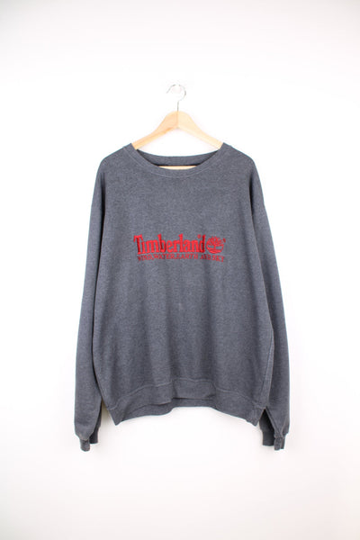 Grey Timberland sweatshirt with red embroidered logo across the chest.
