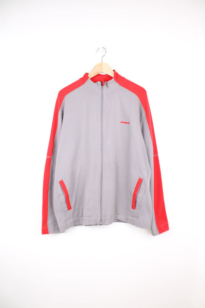 Patagonia zip through sweatshirt in red and grey. Features embroidered logo on the chest. 