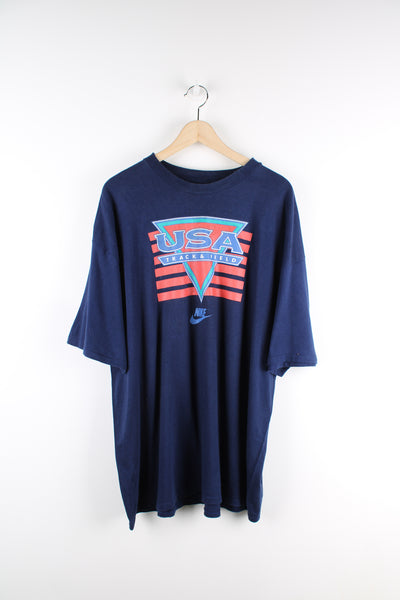 90s Nike USA track and field navy blue single stitch t-shirt, features printed spell-out graphic across the chest