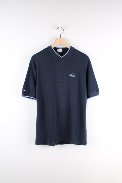 Adidas blue polo style v-neck t-shirt, features embroidered logo on the chest