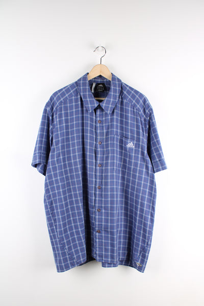 Adidas blue plaid, button up cotton shirt. Features embroidered logo on the chest