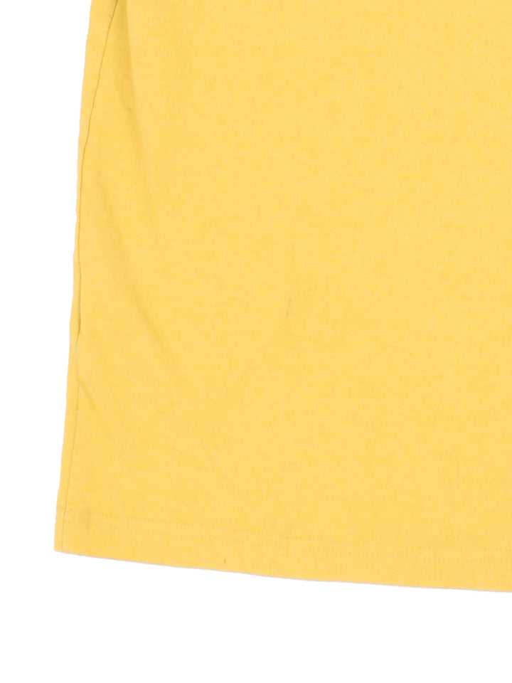 Vintage Carhartt T-Shirt in a yellow colourway with front pocket and logo embroidered on the front.