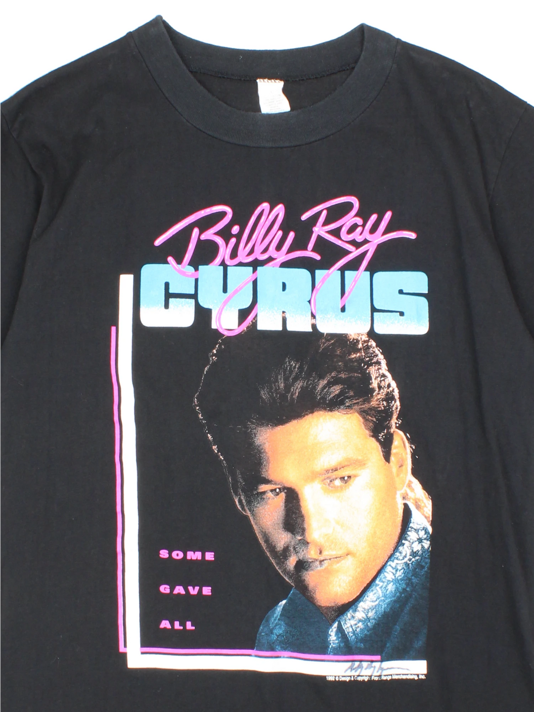 Vintage Billy Ray Cyrus, 1992 Achy Breaky Heart Tour T-Shirt in a black colourway with a graphic print on the front and back, is also signed in the corner on the front.