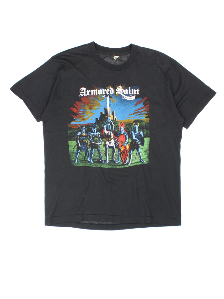 Vintage 80's Armored Saint March Of The Saint single stitch T-Shirt in a black colourway with a medieval knights graphic printed on the front, and the bands pictured and spell out printed on the back.