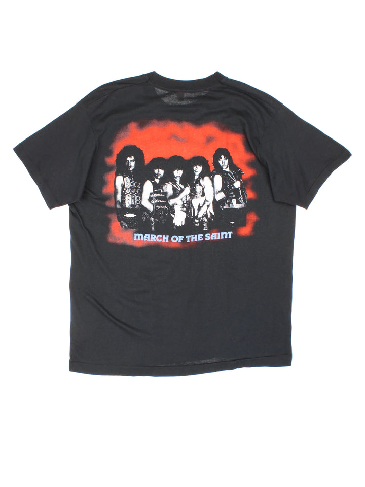 Vintage 80's Armored Saint March Of The Saint single stitch T-Shirt in a black colourway with a medieval knights graphic printed on the front, and the bands pictured and spell out printed on the back.