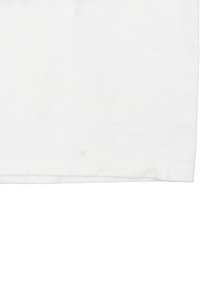 2000 'Indiana State League Champions' white spellout graphic tee with tennis racket and ball design and K. SWISS sponsor logo. Back graphic reading 'USA league tennis presented by Infiniti'.  