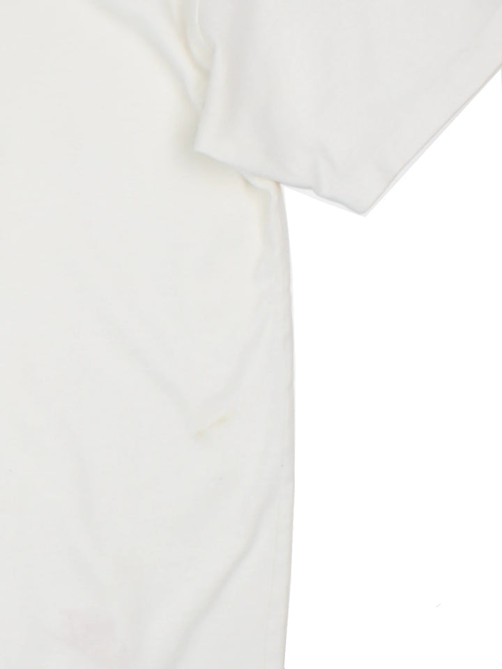 Vintage 90s Nike Flight T-Shirt in a white colourway with a large graphic on the front, and single stitch hem.  