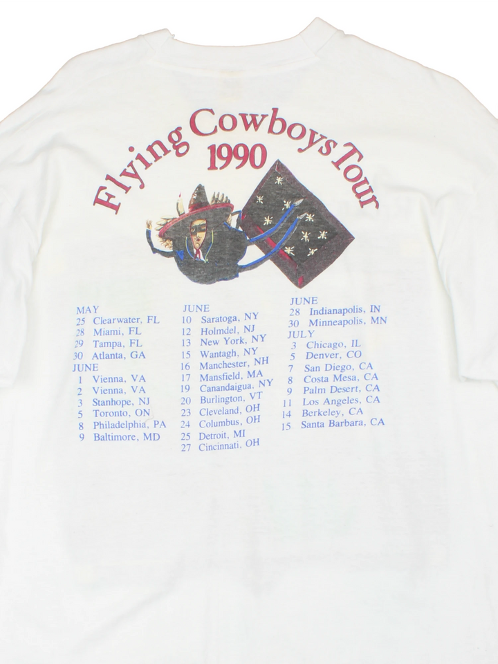 Vintage 1990 Rickie Lee Jones Flying Cowboys Tour T-Shirt in a white colourway, single stitch, and has large art graphic and spell out printed on the front, and on the back has the tour dates and spell out.