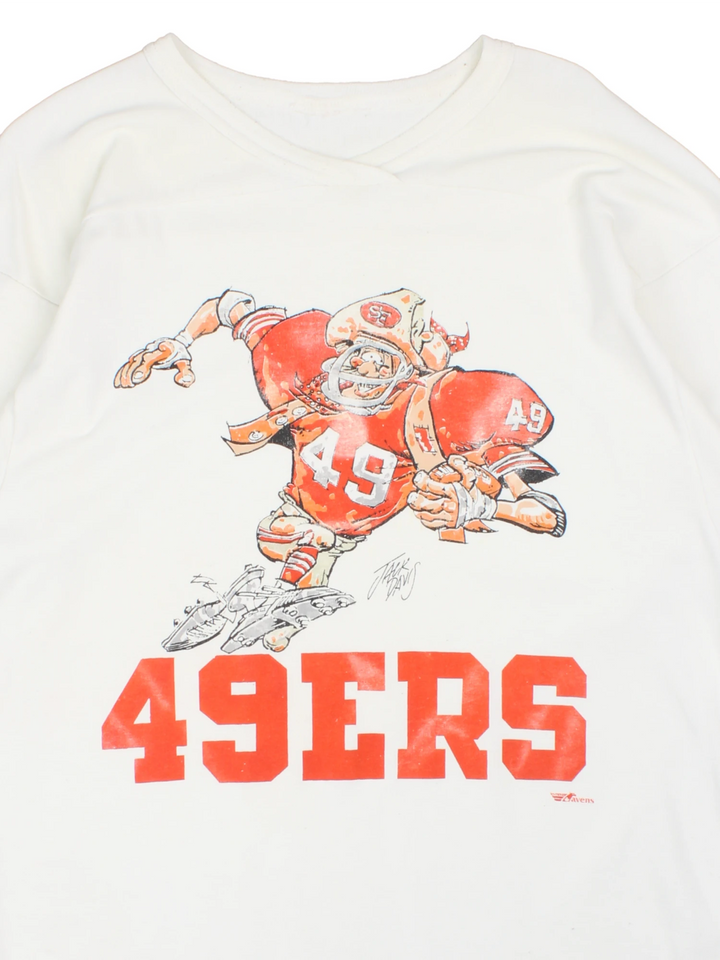 Vintage San Francisco 49ers NFL Jack Davis Graphic Jersey T-Shirt in a white colourway with the spell out logo and Jack Davis football illustration graphic printed on the front.