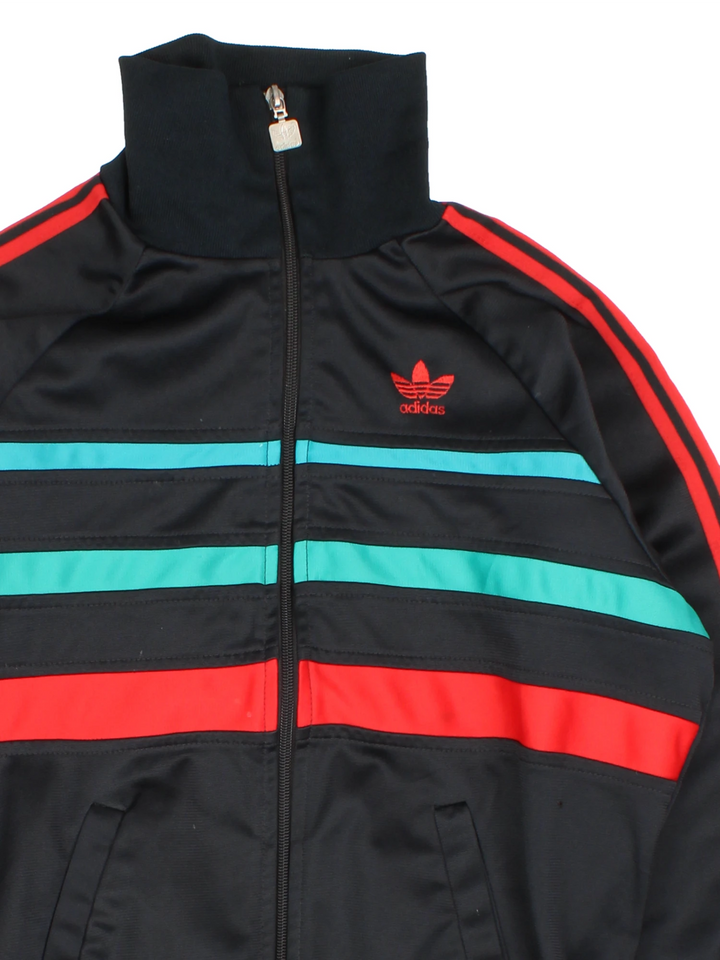 Vintage 80s Adidas tracksuit top in black with red and green stripes. Features embroidered logo on the chest.