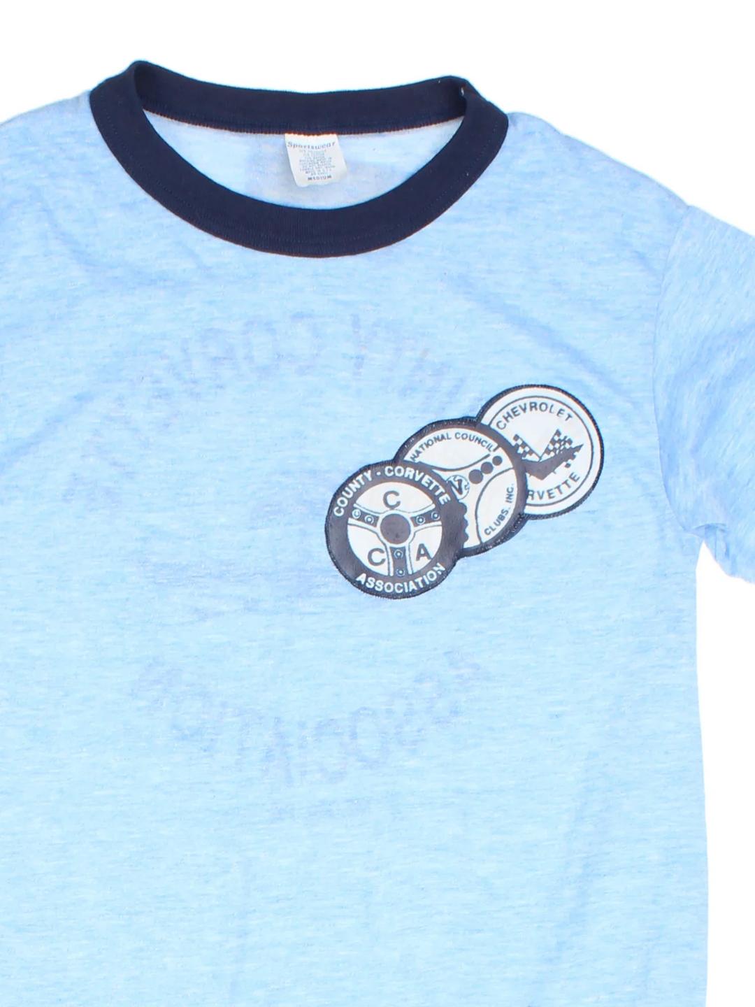 Vintage County Corvette Ringer T-Shirt in a blue colourway with the logo badges embroidered on the front and big graphic print on the back.