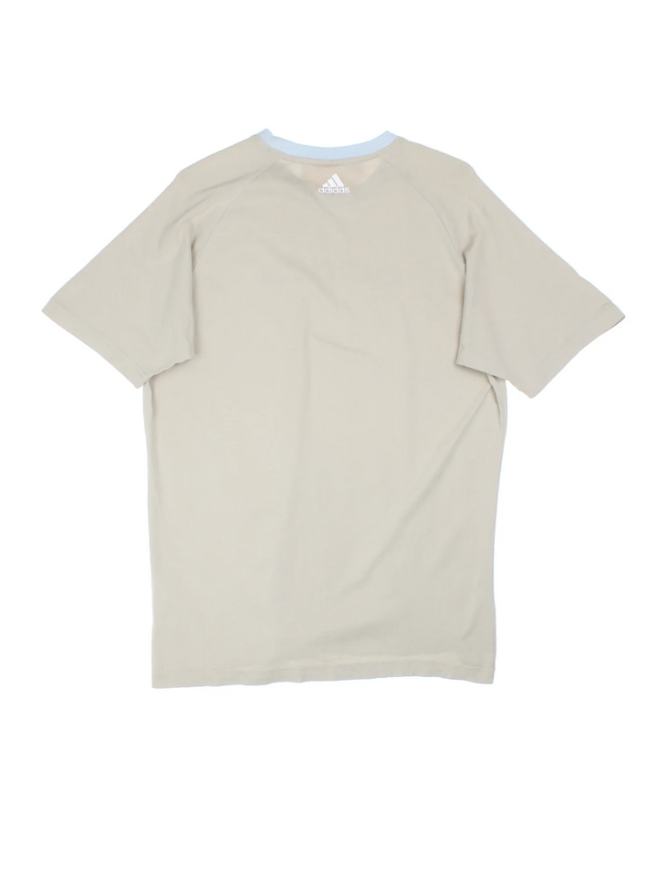 Adidas T-Shirt in a tan colourway with the logo printed on the front.