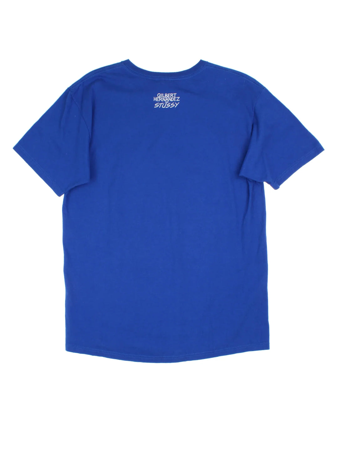 Stussy x Gilbert Hernandez T-Shirt in a blue colourway, with branded graphic printed on the front/back.
