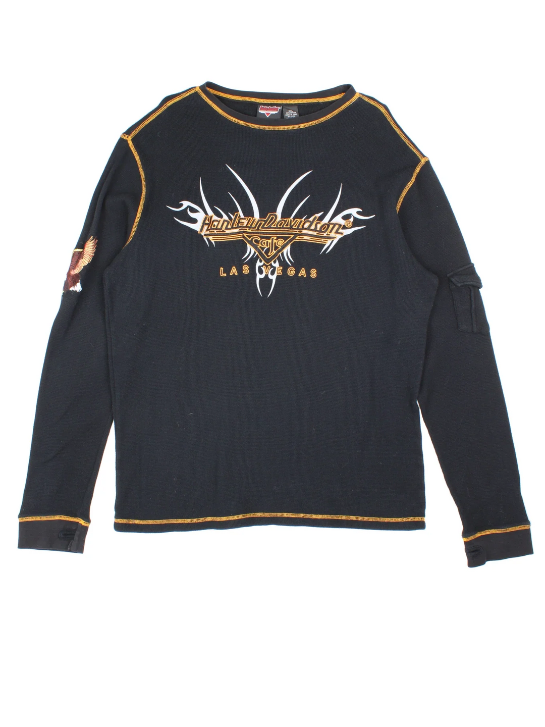 Harley-Davidson Long Sleeve Top in a black colourway, with contrast stitching, has a pocket on the left sleeve and branding printed/embroidered on the front/back/sleeve.