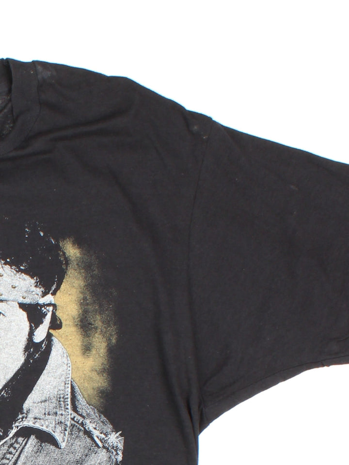 Vintage 1985 Bruce Springsteen World Tour T-Shirt in a black colourway with photo graphic printed on the front and band spell out and graphic on the back.