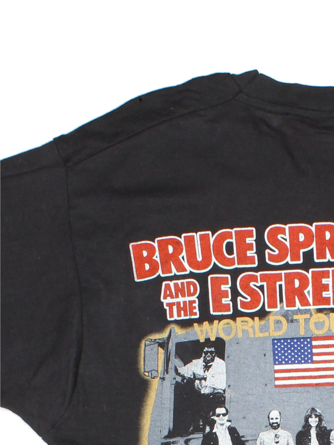 Vintage 1985 Bruce Springsteen World Tour T-Shirt in a black colourway with photo graphic printed on the front and band spell out and graphic on the back.