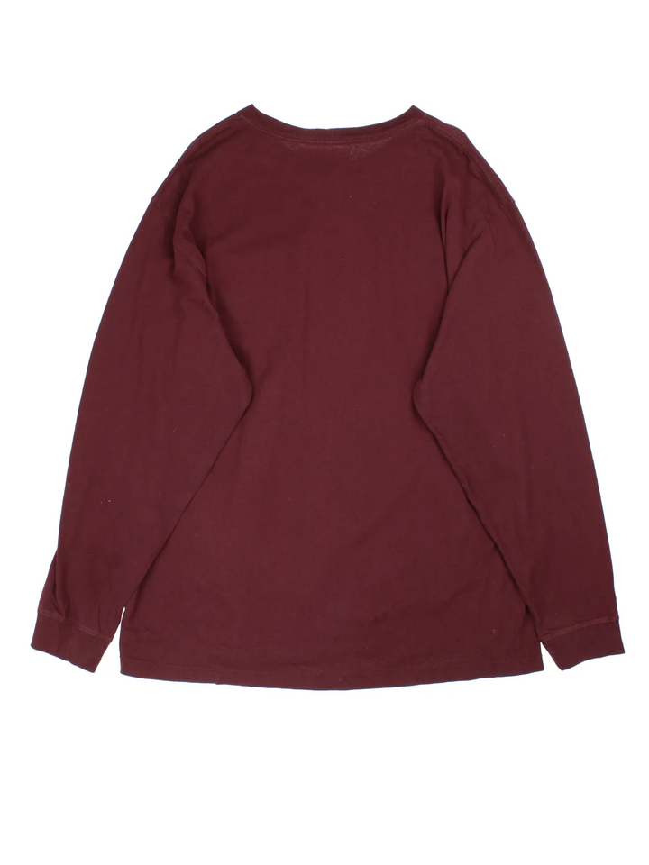 Carhartt Long Sleeve T-Shirt in a burgundy red colourway and has a chest pocket with the logo embroidered on the front.