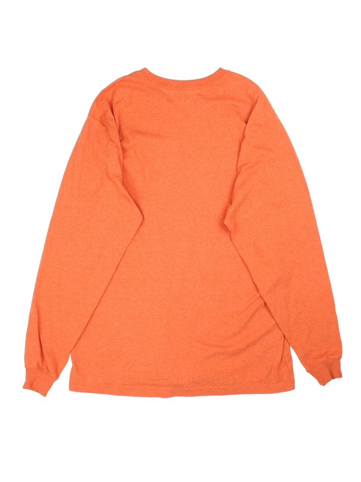 Carhartt Long Sleeve T-Shirt in a orange colourway with the spell out logo printed across the front.