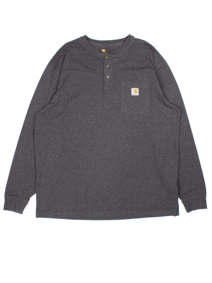 Carhartt Long Sleeve T-Shirt in a grey colourway. Button up with pocket on the front and small classic logo. 