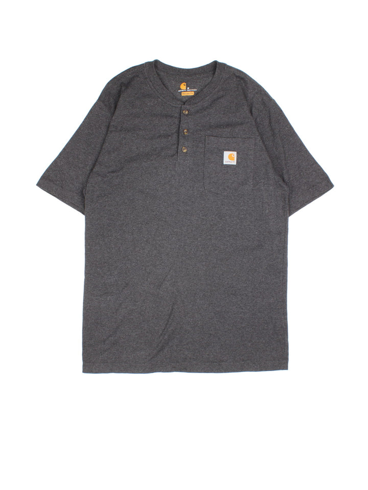 Carhartt T-Shirt in a grey colourway. Button up with pocket on the front and small classic logo..