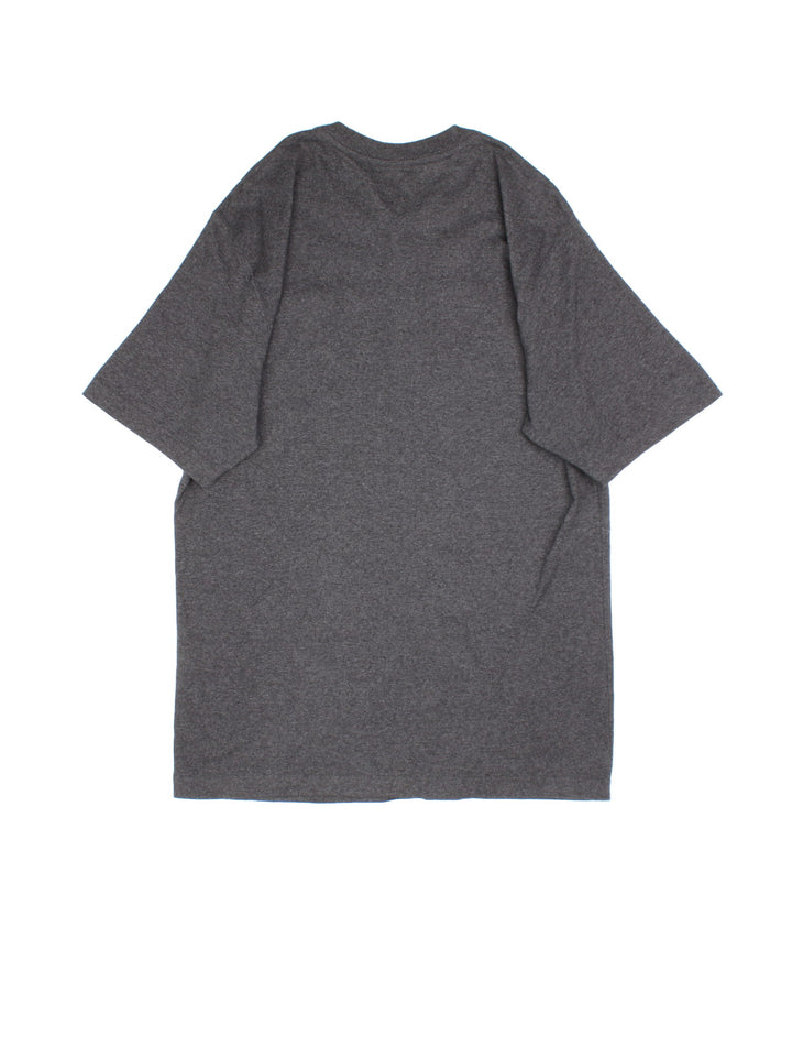 Carhartt T-Shirt in a grey colourway. Button up with pocket on the front and small classic logo..