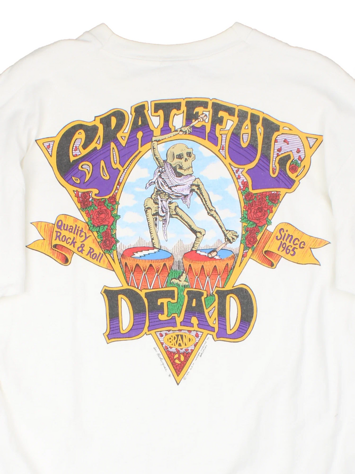 Vintage 1991 Grateful Dead Quality Rock & Roll T-Shirt in a white colourway with small band logo on the front pocket and large graphic on the back.