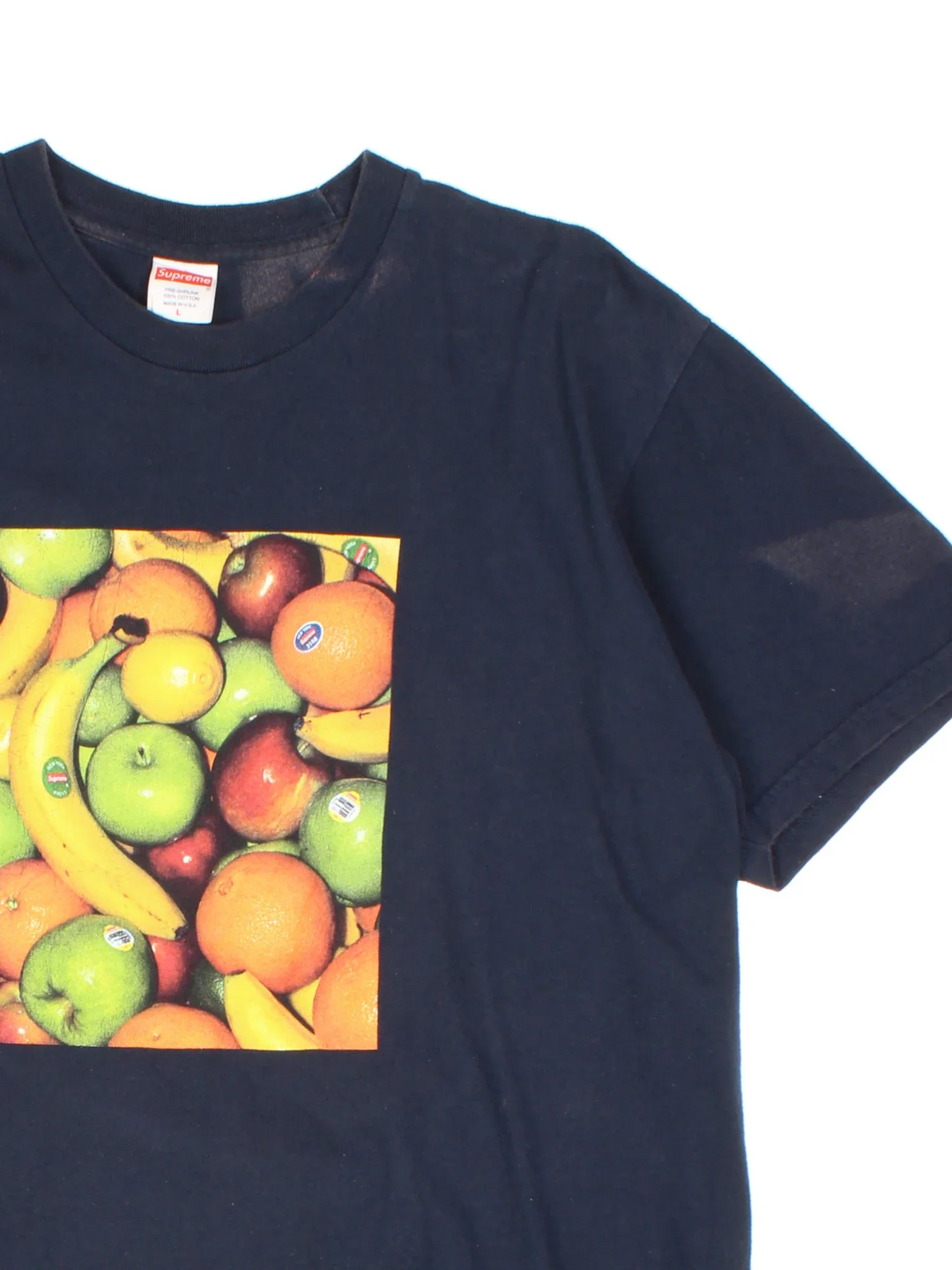 Supreme Fruit T-Shirt in a blue colourway with fruit graphic on the front, and small fruit sticker on the back.