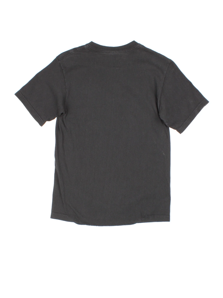 Vintage Stussy International Tribe T-Shirt in a black colourway with neon graphic and logo on the front.