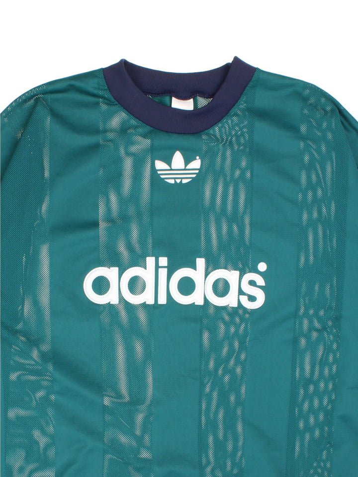 Vintage Stripe Mesh Adidas T-Shirt in a green colourway with spellout logo on the front.