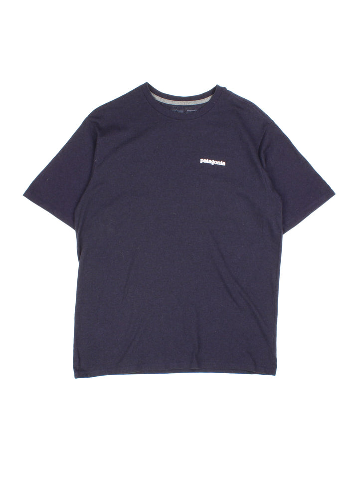 Vintage Patagonia T-Shirt in a blue colourway with branding on front and back.