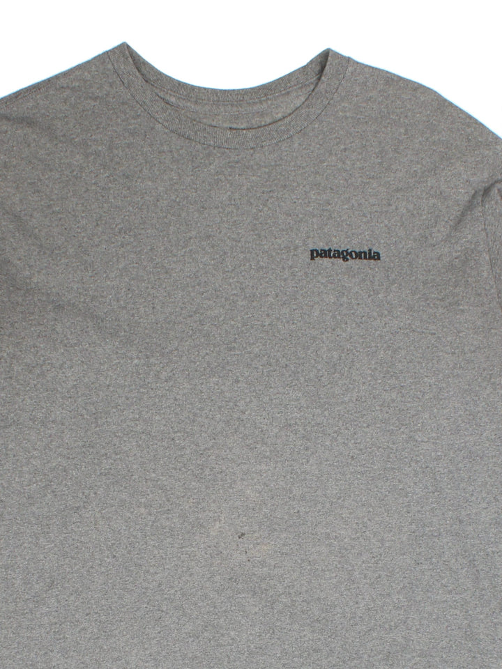 Vintage Patagonia Long Sleeve T-Shirt in a grey colourway with the logo on front and back.